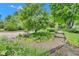 Landscaped gardens with trees, flowering plants, and a stone pathway, offering a serene outdoor experience at 10444 N State Road 9, Fountaintown, IN 46130