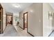 Hallway with views to a bathroom and another room with hardwood trim at 10444 N State Road 9, Fountaintown, IN 46130