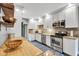 Bright kitchen featuring stainless steel appliances, granite countertops, and stylish white cabinetry at 10444 N State Road 9, Fountaintown, IN 46130