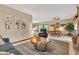 Inviting living room featuring wood coffee table, cozy seating, and bright dining area at 10444 N State Road 9, Fountaintown, IN 46130