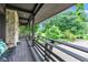 Inviting porch with stone accents and a scenic view of the lush green landscape at 10444 N State Road 9, Fountaintown, IN 46130