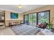 Sun-filled room with outdoor views through sliding doors and a comfortable seating area at 10444 N State Road 9, Fountaintown, IN 46130