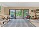 Bright sun room with patio access, natural light, and views of the backyard at 10444 N State Road 9, Fountaintown, IN 46130
