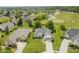 Beautiful aerial view of a home with a well-manicured lawn and a golf course in the background at 10510 Inverness Ct, Fishers, IN 46037