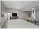 A finished basement with hardwood floors, a large area rug, and a chaise lounge near a decorative pillar at 10510 Inverness Ct, Fishers, IN 46037