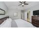 Spacious bedroom featuring a ceiling fan, a walk-in closet and access to an ensuite bathroom at 10510 Inverness Ct, Fishers, IN 46037