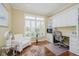 Comfortable home office with built-in shelves, a desk, a chair, and a window with blinds at 10510 Inverness Ct, Fishers, IN 46037