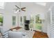 Cozy sunroom with natural light, tile floors, skylights and white plantation shutters at 10510 Inverness Ct, Fishers, IN 46037