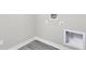 Clean basement area with grey vinyl floors, utility hookups, and convenient electrical outlets at 11588 Brooks Farm Blvd, Noblesville, IN 46060