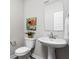 Bathroom features a pedestal sink, a toilet, a mirror and neutral wall color at 11588 Brooks Farm Blvd, Noblesville, IN 46060