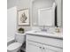 Clean bathroom with white vanity, quartz countertop, and a framed mirror at 11588 Brooks Farm Blvd, Noblesville, IN 46060