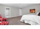 Corner of a main bedroom with plush carpet and natural light with view into the en suite bathroom at 11588 Brooks Farm Blvd, Noblesville, IN 46060