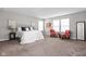 Bright bedroom with a plush carpet, large windows, and a comfortable queen bed at 11588 Brooks Farm Blvd, Noblesville, IN 46060