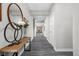 Inviting hallway featuring stylish wood-look floors, elegant decor, and a bright, airy atmosphere at 11588 Brooks Farm Blvd, Noblesville, IN 46060