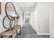 The hallway features wood-look floors and stylish decor at 11588 Brooks Farm Blvd, Noblesville, IN 46060
