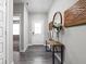 Inviting hallway featuring stylish wood-look floors, elegant decor, and a bright, airy atmosphere at 11588 Brooks Farm Blvd, Noblesville, IN 46060