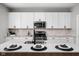 Kitchen featuring granite countertops and modern appliances, including gas range at 11588 Brooks Farm Blvd, Noblesville, IN 46060