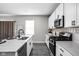 Kitchen featuring granite countertops, stainless steel appliances, and hardwood flooring at 11588 Brooks Farm Blvd, Noblesville, IN 46060