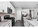 Kitchen features granite countertops, stainless steel appliances and white cabinets at 11588 Brooks Farm Blvd, Noblesville, IN 46060