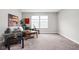 Neutral living room with a comfortable gray sofa, patterned rug, and ample natural light at 11588 Brooks Farm Blvd, Noblesville, IN 46060