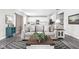 Comfortable living room with stylish decor, wood-look floors, and an open layout at 11588 Brooks Farm Blvd, Noblesville, IN 46060