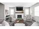 Cozy living room featuring a fireplace, comfortable seating, and ample natural light at 11588 Brooks Farm Blvd, Noblesville, IN 46060