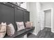 Stylish mudroom features a built-in bench with decorative pillows, and convenient hooks, creating an organized entryway at 11588 Brooks Farm Blvd, Noblesville, IN 46060