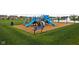 Community playground featuring colorful slides, climbing structures, and a soft surface for safe play at 11588 Brooks Farm Blvd, Noblesville, IN 46060