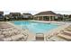 Community pool featuring lounge chairs and a covered area, perfect for relaxation and recreation at 11588 Brooks Farm Blvd, Noblesville, IN 46060