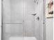 New glass enclosed shower featuring new fixtures and tile at 11588 Brooks Farm Blvd, Noblesville, IN 46060