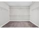 Walk-in closet with metal shelves and neutral carpeting providing ample storage space at 11588 Brooks Farm Blvd, Noblesville, IN 46060
