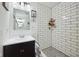 Modern bathroom with a walk-in shower featuring subway tile and a sleek vanity at 117 N Market St, Thorntown, IN 46071