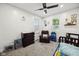 A bedroom with carpeted floors, a crib, dresser, chair, and windows with blinds at 117 N Market St, Thorntown, IN 46071