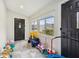 Bright entryway with natural light and colorful toys at 117 N Market St, Thorntown, IN 46071