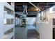 Laundry area in the basement, equipped with a washer, dryer, and storage shelving at 1311 N Oakland Ave, Indianapolis, IN 46201