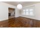 Bright dining room featuring beautiful hardwood floors, large windows, and access to the kitchen at 1311 N Oakland Ave, Indianapolis, IN 46201