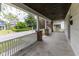 Spacious front porch with brick pillars and white railings overlooking the street at 1311 N Oakland Ave, Indianapolis, IN 46201