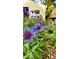 Lush garden featuring vibrant purple flowers and greenery, perfect for relaxation at 1311 N Oakland Ave, Indianapolis, IN 46201
