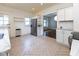 Eat-in kitchen features stainless appliances, white cabinets, and convenient access to the dining room at 1311 N Oakland Ave, Indianapolis, IN 46201