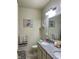 Bathroom with granite double vanity, neutral walls and tile flooring at 1349 Sunset Blvd, Avon, IN 46123