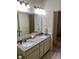 Bathroom with granite double vanity, neutral walls, and a large vanity mirror at 1349 Sunset Blvd, Avon, IN 46123