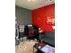 A gamer's bedroom with a desk, comfortable seating, and gaming-themed décor on the walls at 1349 Sunset Blvd, Avon, IN 46123