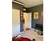 A bedroom with gray walls, white trim, artwork, and ample space at 1349 Sunset Blvd, Avon, IN 46123