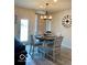 Bright dining area with modern chandelier and ample natural light at 1349 Sunset Blvd, Avon, IN 46123