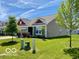 Well maintained house with an attached garage and front yard landscaping at 1349 Sunset Blvd, Avon, IN 46123