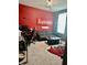 Fun game room with red walls, a comfortable seating area, and cool lighting for ultimate relaxation and entertainment at 1349 Sunset Blvd, Avon, IN 46123