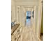 Bright hallway with light floors leading to a glimpse of the living room, showcasing the home's open layout at 1349 Sunset Blvd, Avon, IN 46123