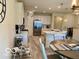 Bright eat-in kitchen with a breakfast bar island, stainless steel appliances, and modern lighting at 1349 Sunset Blvd, Avon, IN 46123