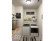Laundry room featuring a white washer and dryer, butcher block folding table and decor at 1349 Sunset Blvd, Avon, IN 46123