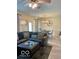Comfortable living room features an L-shaped sofa and a view into the dining area at 1349 Sunset Blvd, Avon, IN 46123